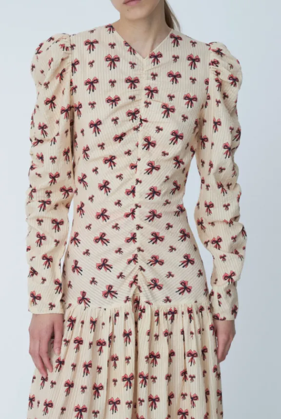 midi_dress_with_allover_b_5.webp Stella Nova Midi Dress with Allover Bow Print - Latte | Dresses