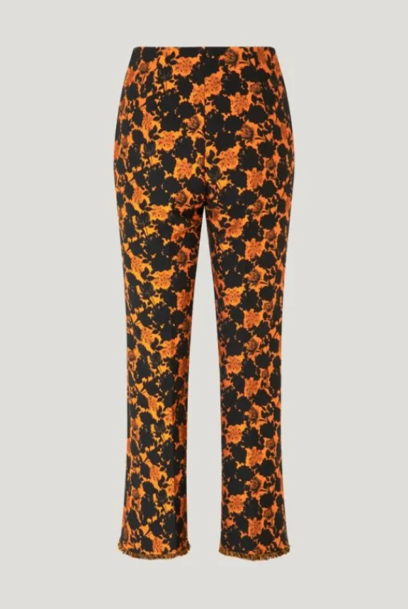 nenne_trousers__orange_bl_4.webp Baum Und Pferdgarten Nenne Trousers - Orange Black Flower | Trousers And Playsuits | Suits & Co-Ordinates